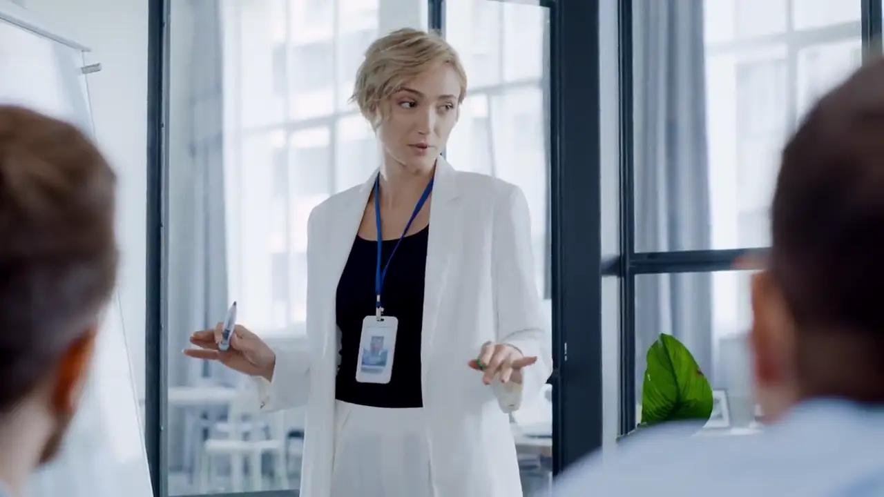 A sales leader presenting to her team